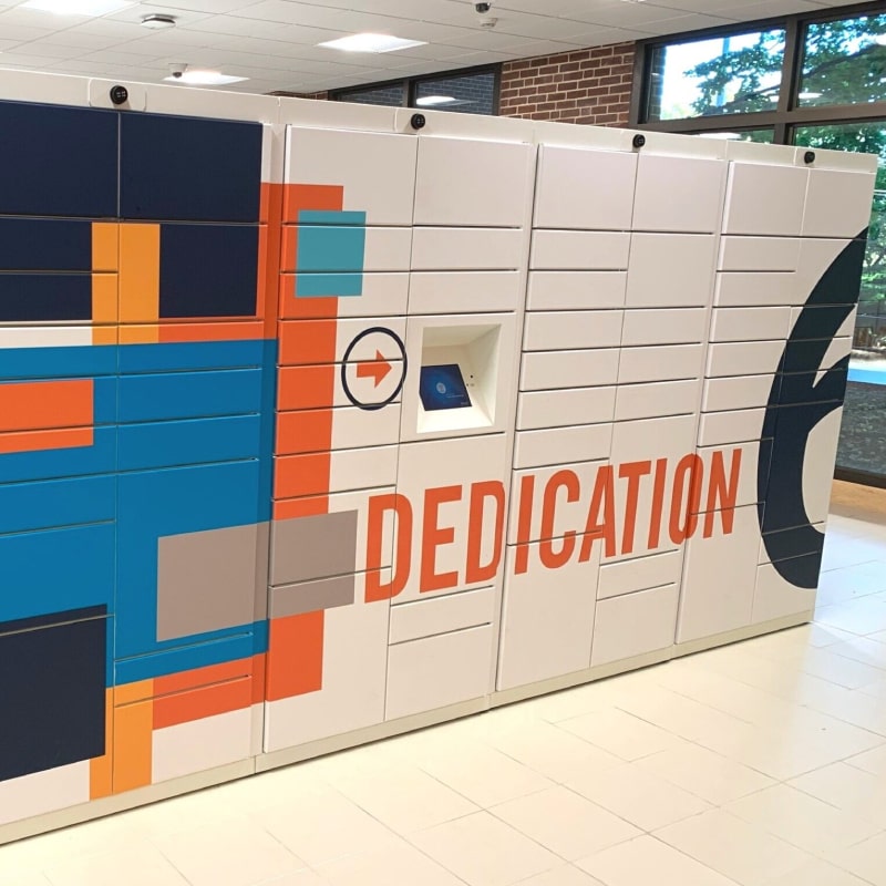 Smart lockers for packages with a smart locker in a building with custom wrap