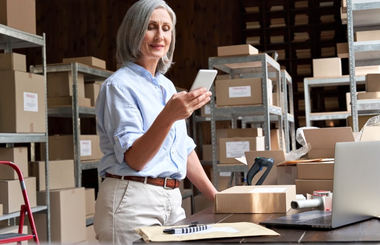 Brynka Mail Center Solution includes extended capability with mobile app featuring woman using mobile device