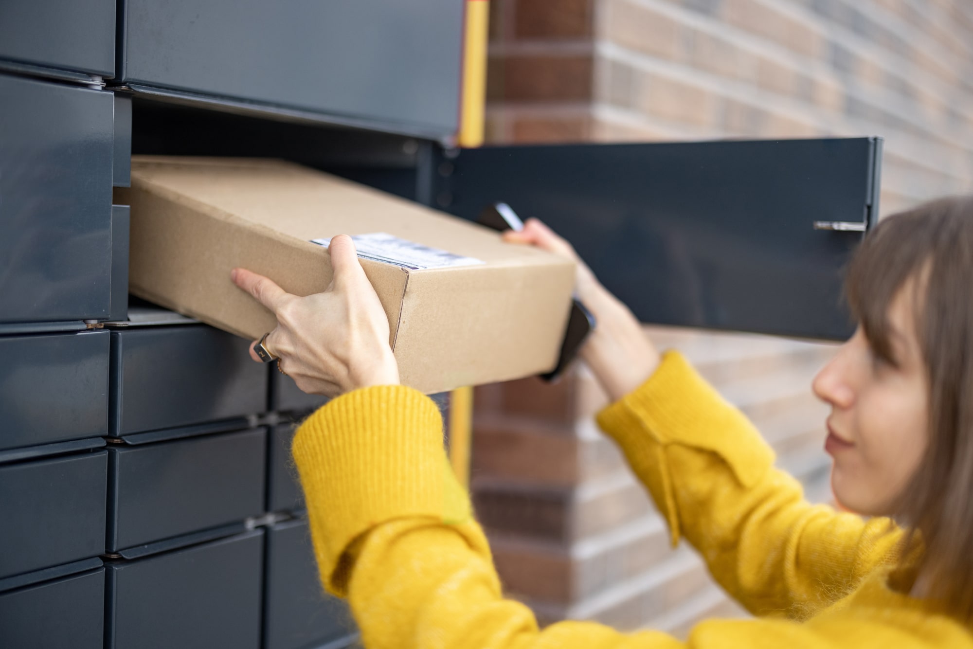 Student receiving package from smart locker at school